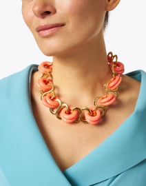 Look image thumbnail - Kenneth Jay Lane - Coral and Gold Resin Rings Link Necklace
