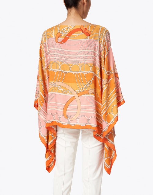Back image - Rani Arabella - Orange Silk Cashmere Saddle Print Poncho